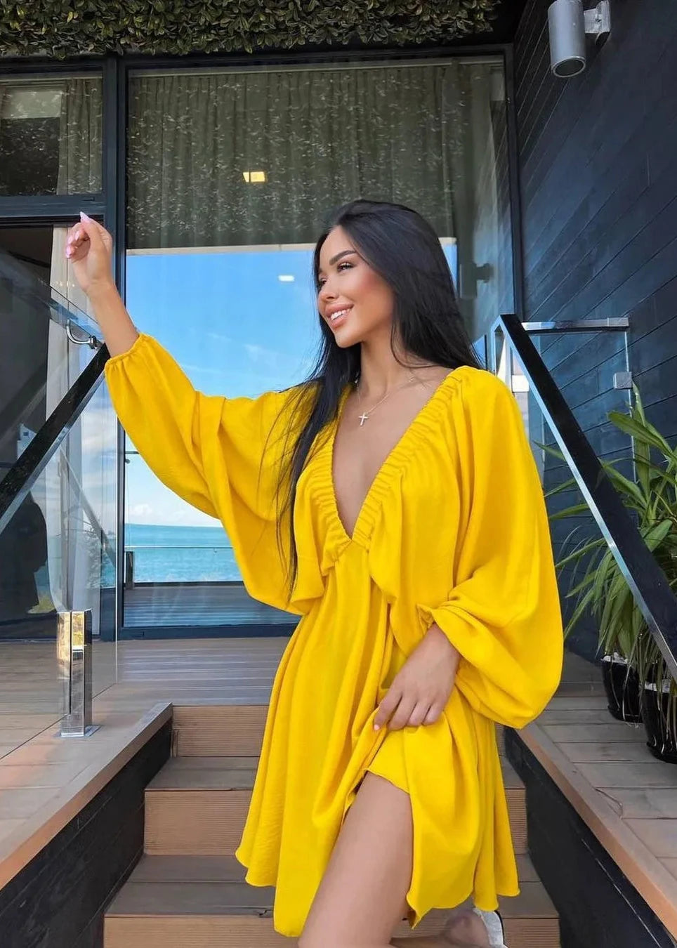 Robe élégante à manches lanternes et décolleté en V