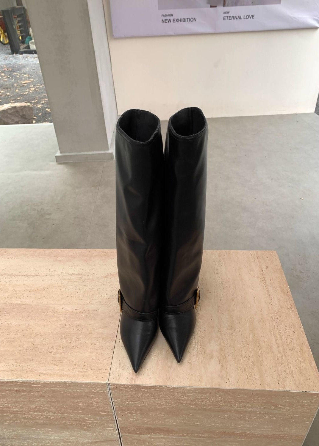 Black Pointed-Toe Knee-High Boots with Buckle Strap